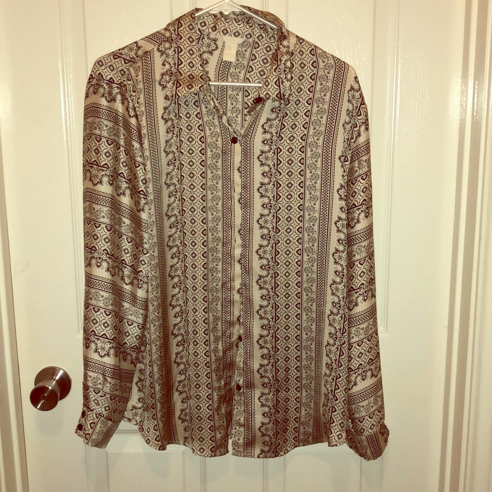 Patterned black and silver silky blouse.